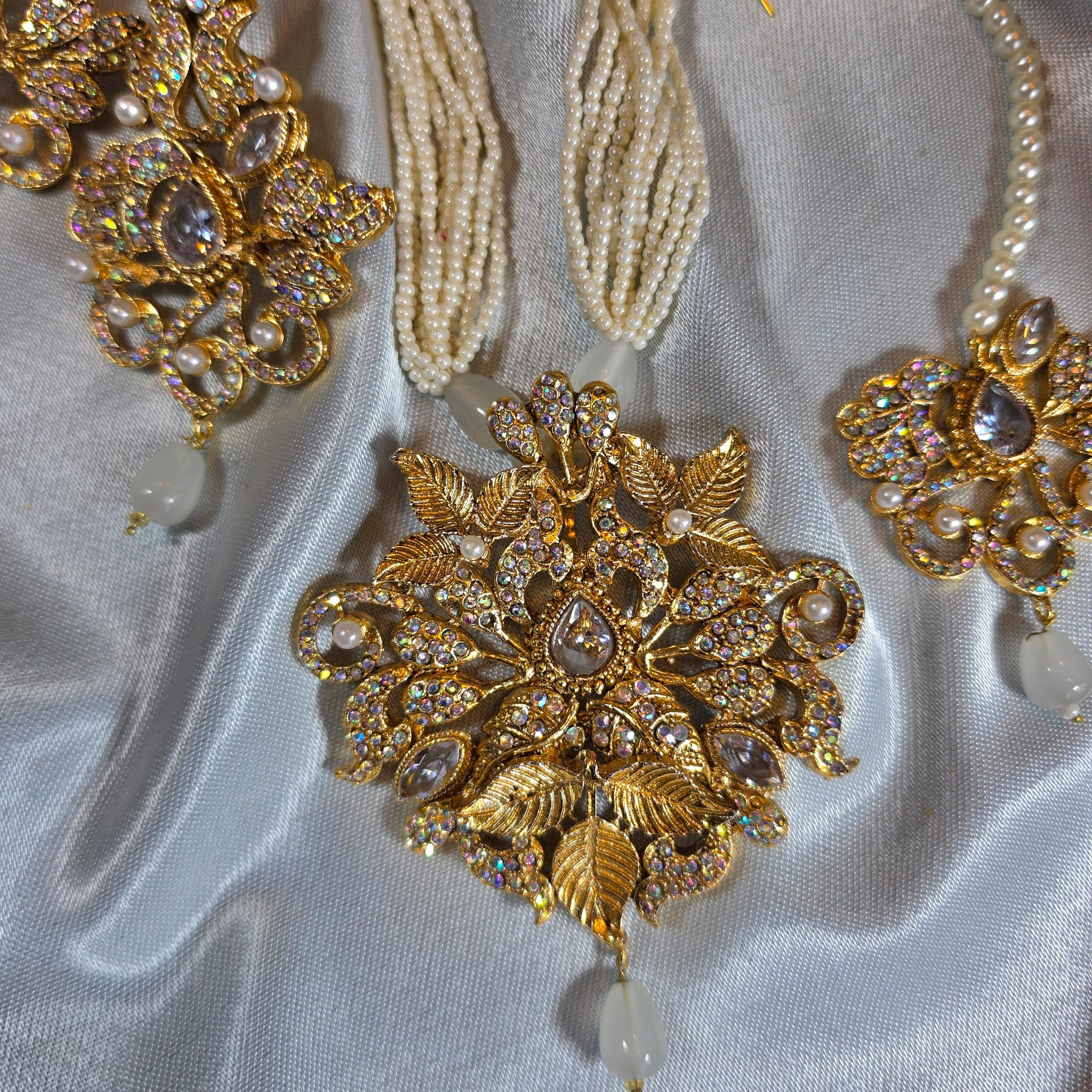 Gold with clear stone Mausam